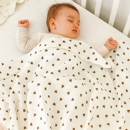 Couverture bébé adaptée au lit