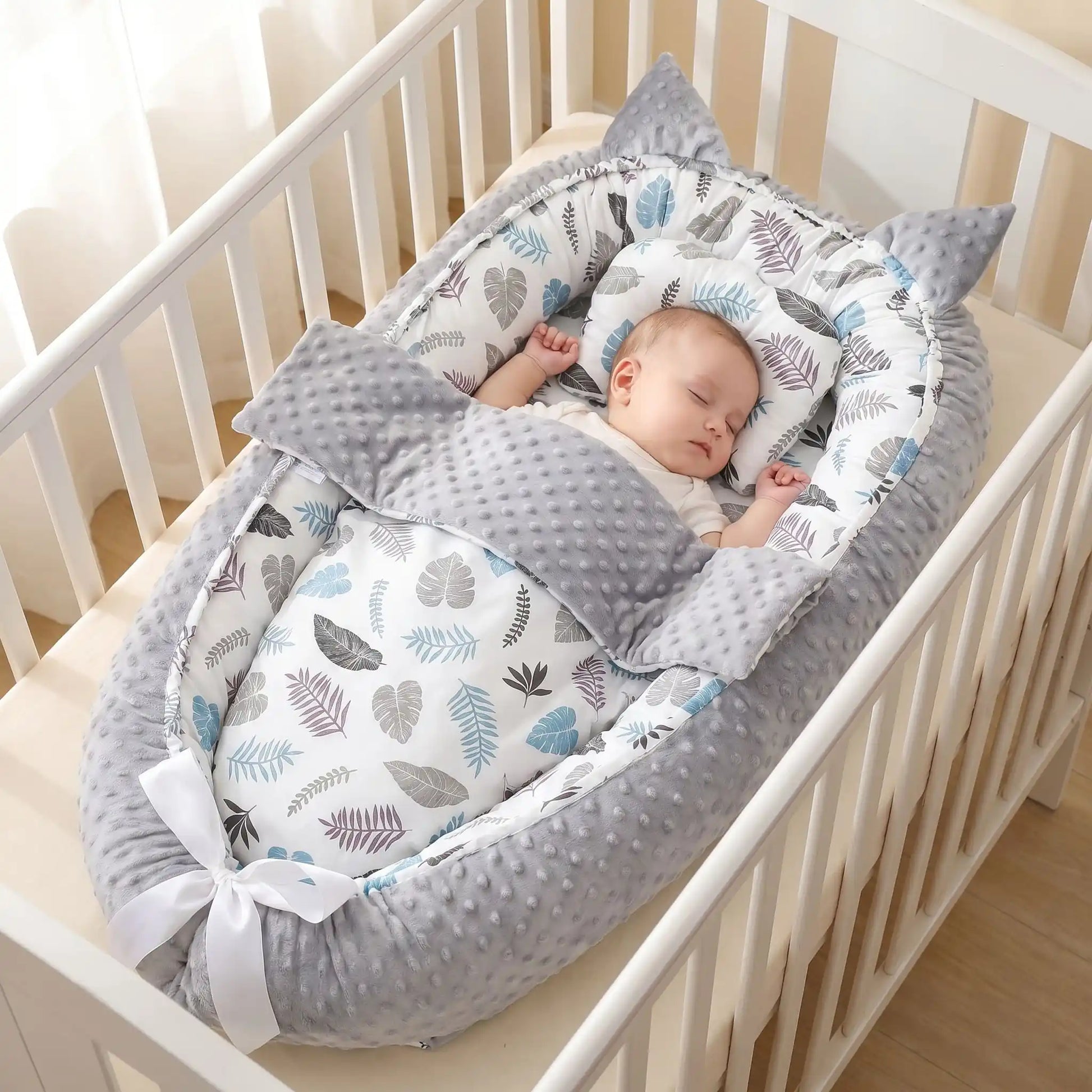 réducteur de lit bébé cocon rassurant